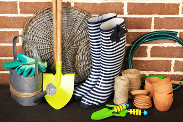 Tools of gardener on  bricks background