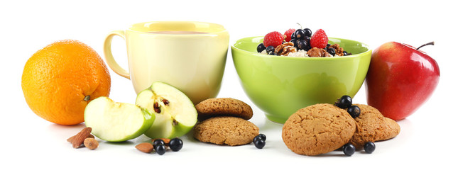 Healthy oatmeal in bowl with berries and fruits, isolated