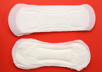 Woman hygiene protection on red background, close-up
