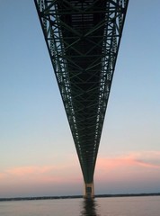 Sailing under the Mackinac Bridge at daybreak