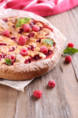 Tasty cake with berries on table close-up