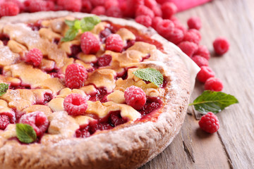 Tasty cake with berries on table close-up