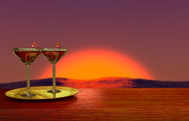 two glasses on golden plate with romantic sunset on background