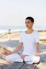 Fototapeta na wymiar young woman meditating