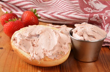 Strawberry cream cheese on a bagel