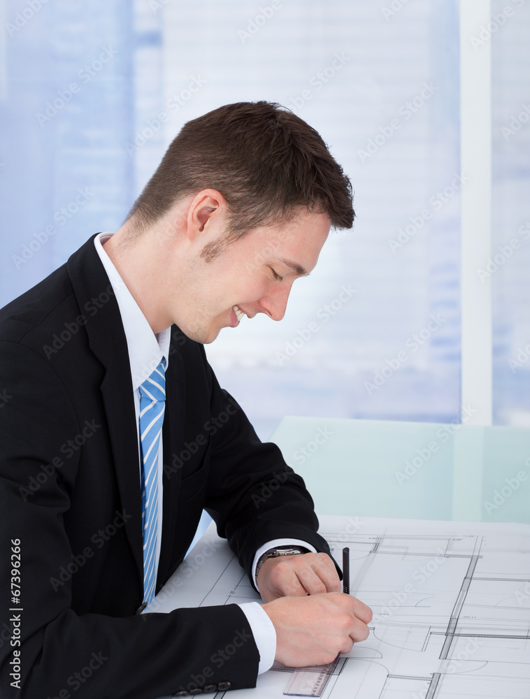 Poster Architect Working On Blueprint At Desk
