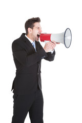 Businessman Screaming Into Megaphone