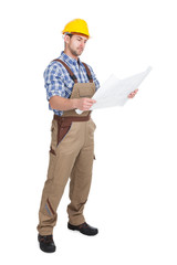 Worker Reading Blueprint Over White Background