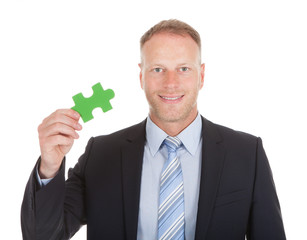 Confident Businessman Green Jigsaw Piece