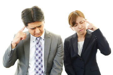 苦悩するビジネスマンとOL