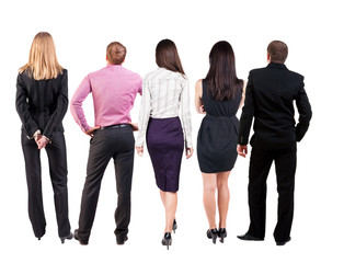 Obraz premium Back view of business people looks at wall. 