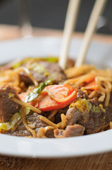 Close up thai stir fried noodles beef chopsticks food