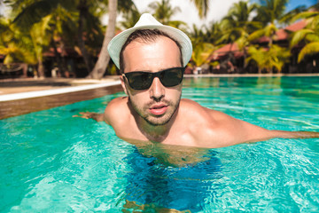 sexy guy coming out of swimming pool