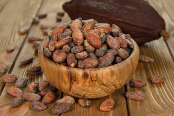 Cocoa beans in a wooden bowl