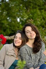 Fototapeta premium Two beautiful young women smiling on a summer day