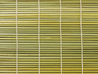 Bamboo brown straw mat as abstract texture background compositio