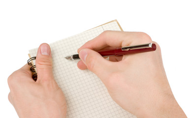 Hand writing on empty notepad (notebook) isolated on white