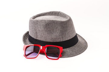 Hat , sunglasses isolated on white