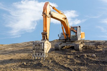 Big excavator on construction site