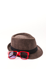 Hat , sunglasses isolated on white