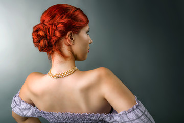 Young woman with elegant braided hairstyle