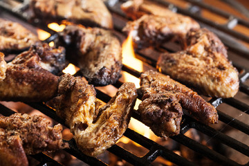 Grilling chicken wings on barbecue grill