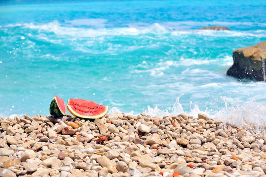 slice of watermelon on the seashore