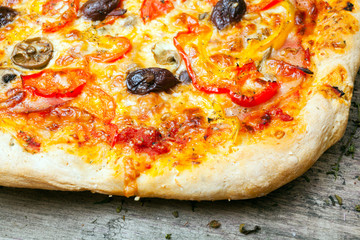 Delicious italian pizza served on wooden table