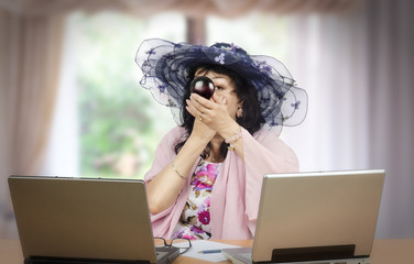 Portrait of mature actress applying compact powder