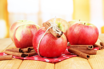 Ripe apples with with cinnamon sticks