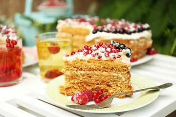 Tasty cake with fresh berries on table, close up