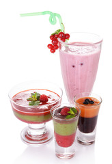 Glasses of tasty smoothies and milk shake, isolated on white