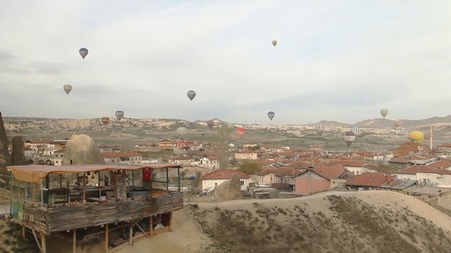 Hot Air Balloons flying over a city