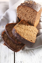 Fresh bread on wooden table, close up