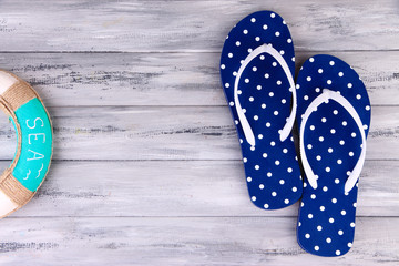 Color flip-flops on wooden background