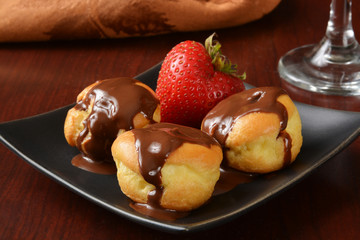 chocolate covered vanilla cream puffs
