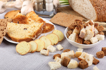 Homemade croutons on table in kitchen, close up