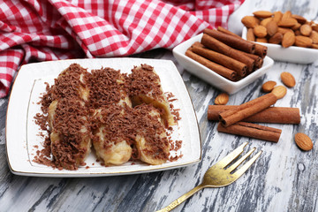 Sweetened fried banana on plate, close-up