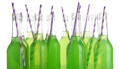 Bottles of drink with straw isolated on white