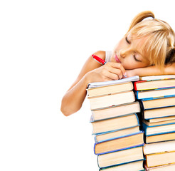 Tired schoolgirl sleeping on stack of books. Education concept