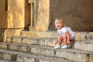 Girl sitting on the steps of the porch