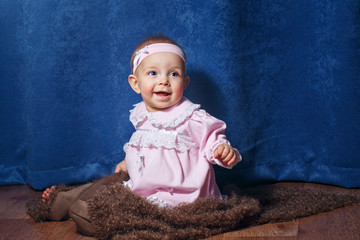 Fototapeta premium Cute little girl in pink dress