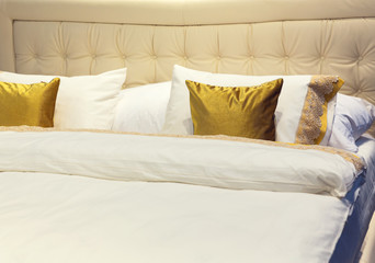 Colorful pillows on hotel bed
