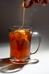 Tea filter splashes into glass
