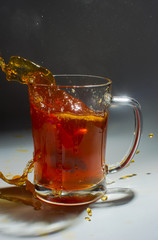 Tea filter splashes into glass