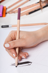 Closeup of woman's hand drawing