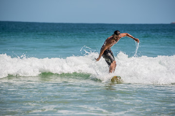 Surfer at Ilha Grande, Lopes Mendes beach. Funny. Brazil Rio do