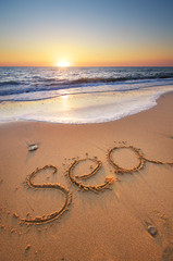 Sea word on the beach