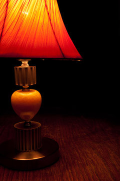Old-fashioned table-lamp in low key style