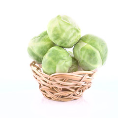 Tiny wicker with the raw Brussels sprout